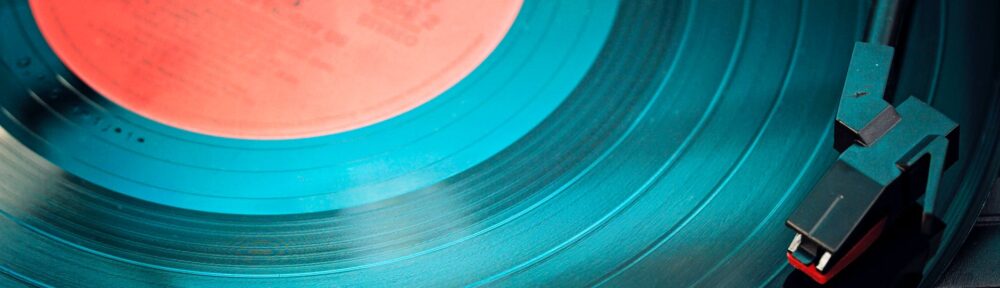 blue vinyl record playing on turntable